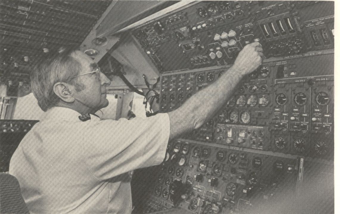 1981 A Flight Engineer at the engineers panel of a Pan Am Boeing 747.  Later versions of the 747 only require two pilots as the engineers function was incorporated into the pilot & co-pilots duties.